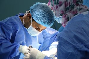 Doctors Performing Surgery in ICU
